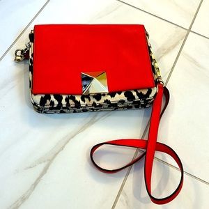 Kate Spade orange and print crossbody bag.